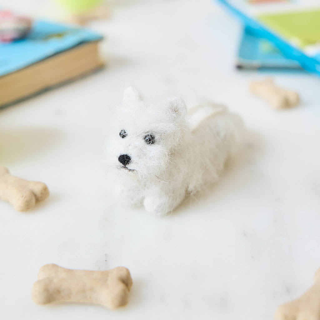 Full of personality and unmistakable charm, our alpaca&nbsp;Westie Ornament brings this beloved breed to life in soft, handcrafted detail. Carefully made by skilled artisans, this adorable pup features the Westie’s signature fluffy white coat, alert expression, and compact, sturdy stance.