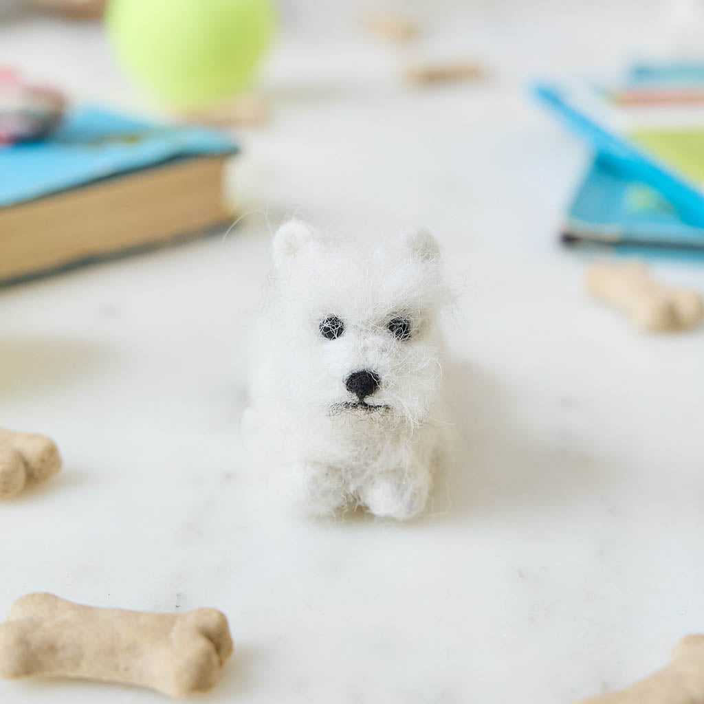Full of personality and unmistakable charm, our alpaca&nbsp;Westie Ornament brings this beloved breed to life in soft, handcrafted detail. Carefully made by skilled artisans, this adorable pup features the Westie’s signature fluffy white coat, alert expression, and compact, sturdy stance.