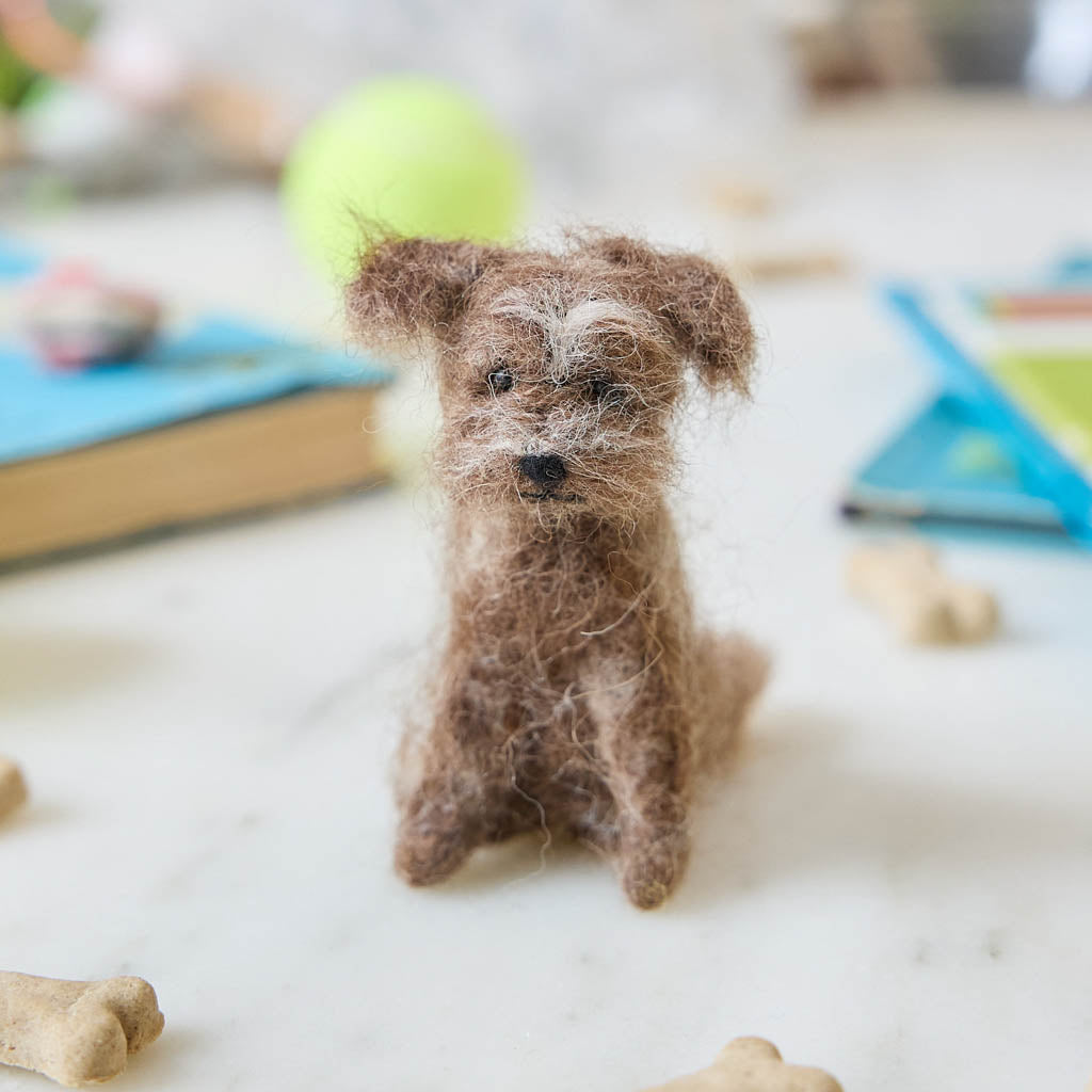 Celebrate the one-of-a-kind charm of man’s best friend with our felt Scruffy Mutt Ornament. Handcrafted by skilled artisans, this adorable pup features a tousled coat, floppy ears, and a sweet, soulful expression that captures the personality of beloved mixed-breed dogs everywhere.