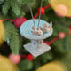 Celebrate the gentle rhythms of the garden with our Bird Bath Ornament. This charming felt scene features two tiny birds enjoying a quiet splash, capturing the simple joy of watching backyard birds gather for a drink on a sunny day.