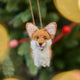 Bring a little wagging joy to your holiday decor with our irresistibly cute Felted Alpaca Corgi Ornament. Lovingly handmade by skilled artisans, this cheerful pup features the corgi’s signature golden coat, perky ears, and—of course—its famously adorable heart-shaped butt.