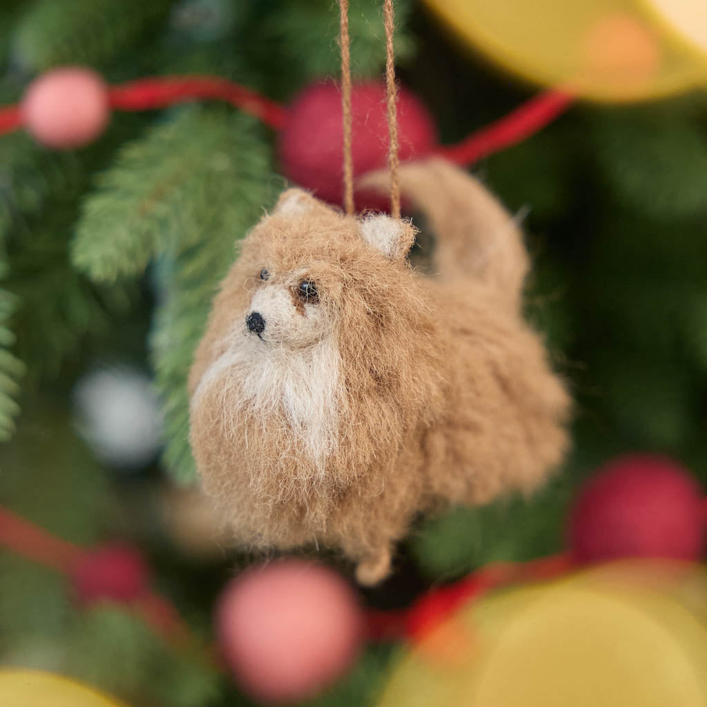 Small in size but big in personality, our alpaca Pomeranian Ornament brings the irresistible fluff and charm of this beloved breed to life. Carefully handcrafted by skilled artisans, this adorable ornament features a soft, full coat, bright eyes, and a sweet, alert expression that perfectly reflects the Pomeranian’s spirited nature.