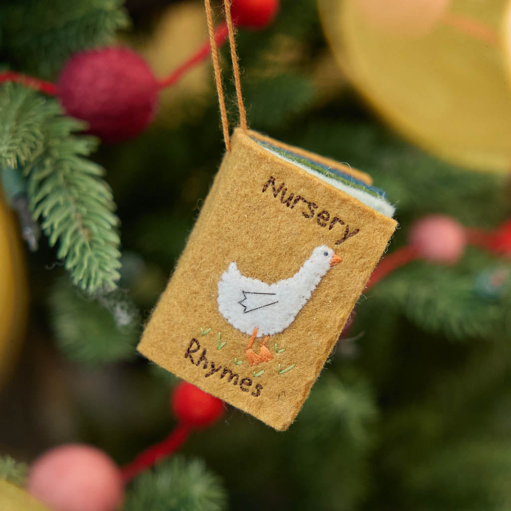 handcrafted miniature nursery rhymes book celebrating classic childhood tunes and stories, ready to hang on the tree or in the nursery! Mother Goose treasury in a handcrafted ornament