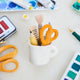 Bring the charm of the classroom and the drafting table to your holiday décor with our Pencil Cup Felt Ornament. This handcrafted design features a soft wool felt mug filled with iconic school and creative essentials—bright scissors, a pencil, a paintbrush, a fountain pen, and a ruler—capturing the everyday magic of learning and creativity.&nbsp;