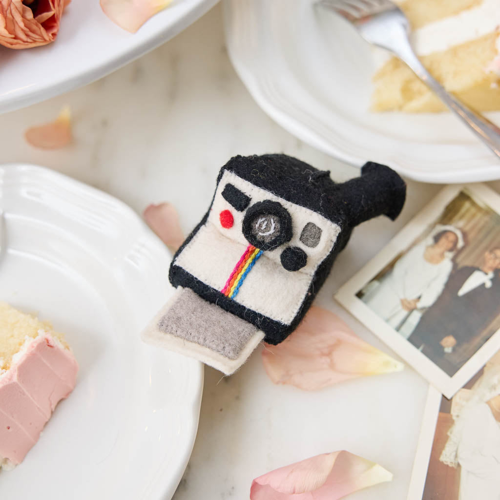 A retro-inspired felt Polaroid camera ornament that captures the joy of memories and nostalgia—perfect for photographers and meaningful gifting.
