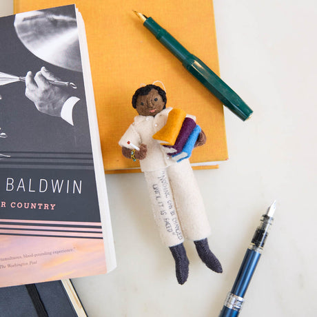 Honor the legacy of James Baldwin with this handcrafted felt ornament, a tribute to one of the most influential voices in American literature and LGBTQ+ history.