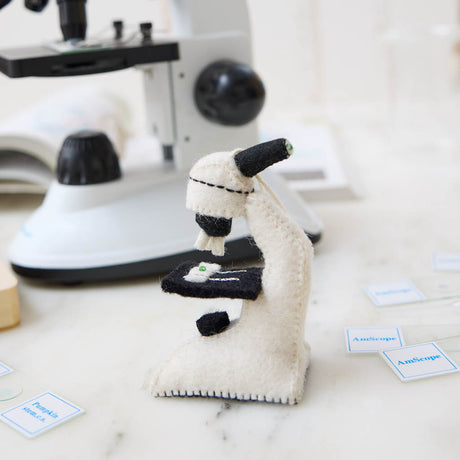 Celebrate curiosity, discovery, and the wonders of science with our handmade Felt Microscope Ornament — a charming keepsake perfect for scientists, biology lovers, teachers, researchers, lab technicians, and STEM enthusiasts.