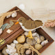 Bring a touch of the shoreline to your holiday décor with our delightful Spotted Sandpiper Ornament. Carefully handcrafted from eco-friendly wool felt, this charming bird captures the distinctive features of the beloved sandpiper, from its warm brown plumage and bright orange beak to its delicate spotted breast.