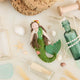 Add a touch of ocean magic to your Christmas tree with our beautiful Siren Mermaid Ornament. Lovingly handcrafted from eco-friendly wool felt, this elegant mermaid features flowing brunette hair, a vibrant green tail adorned with sparkling bead accents, and charming floral details inspired by the treasures of the sea.