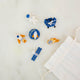 Blast off into a universe of discovery with our Space Mini Ornaments Set. This delightful collection includes five handcrafted felt ornaments inspired by the wonders of space: an astronaut, satellite, space shuttle, rocket ship, and meteor, along with a coordinating Explorer badge that can be displayed as a keepsake or worn as a symbol of curiosity and adventure.