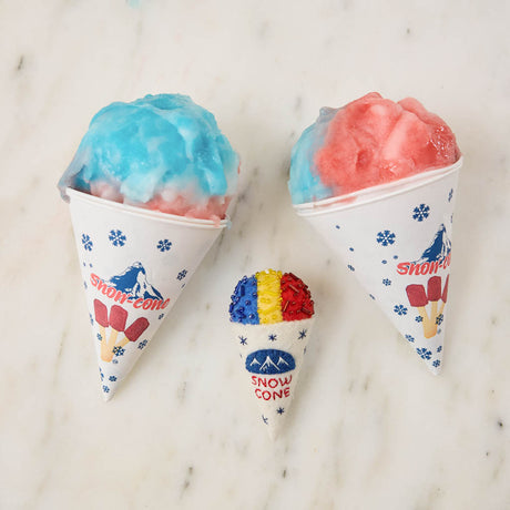 Cool off your Christmas tree with our Summer Snow Cone Ornament, a cheerful felt ornament inspired by one of summer’s most iconic frozen treats. Handcrafted by skilled artisans using traditional felting techniques, this whimsical ornament features a vibrant tri-color snow cone topped with sparkling bead accents that mimic crunchy ice crystals. The detailed white cone is embroidered with classic snow cone graphics and playful lettering, capturing the carefree spirit of amusement parks, beach vacations, and s