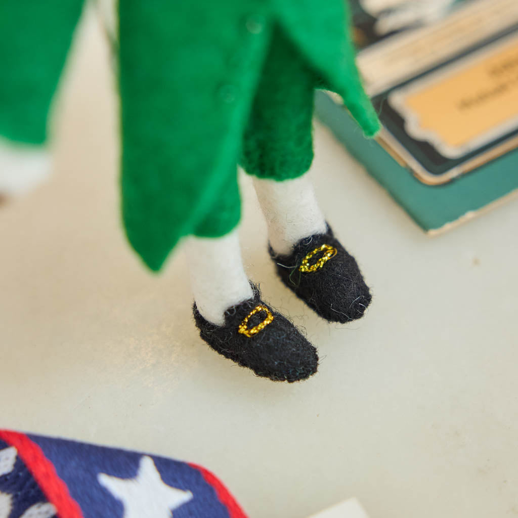 Celebrate the cultural phenomenon that brought Revolutionary history to a new generation with our handcrafted Lin-Manuel Miranda as Hamilton Ornament. Inspired by his iconic portrayal of Alexander Hamilton, this felt ornament captures the energy, creativity, and theatrical spirit of a groundbreaking American story.