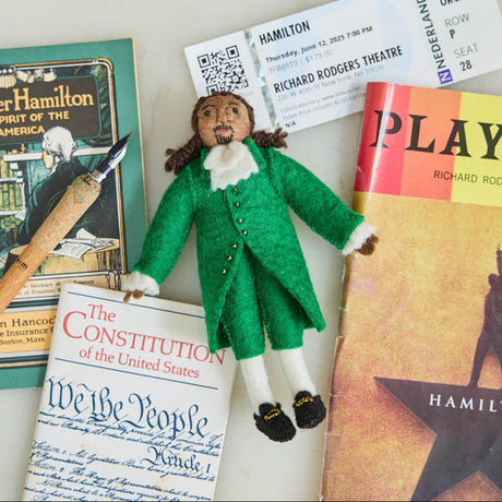 Celebrate the cultural phenomenon that brought Revolutionary history to a new generation with our handcrafted Lin-Manuel Miranda as Hamilton Ornament. Inspired by his iconic portrayal of Alexander Hamilton, this felt ornament captures the energy, creativity, and theatrical spirit of a groundbreaking American story.