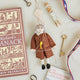 Honor the brilliance and ingenuity of a true American icon with our handcrafted Benjamin Franklin Ornament from the Craftspring Semiquincentennial Collection. Featuring Franklin in his classic colonial attire while flying a kite with a key
