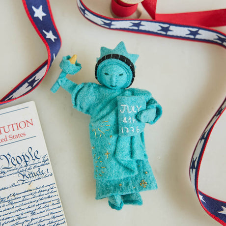 Celebrate American independence with this handcrafted July 4th Lady Liberty Ornament. Inspired by the Statue of Liberty and the founding of the United States, it's perfect for Christmas trees, Fourth of July celebrations, and Americana holiday décor.