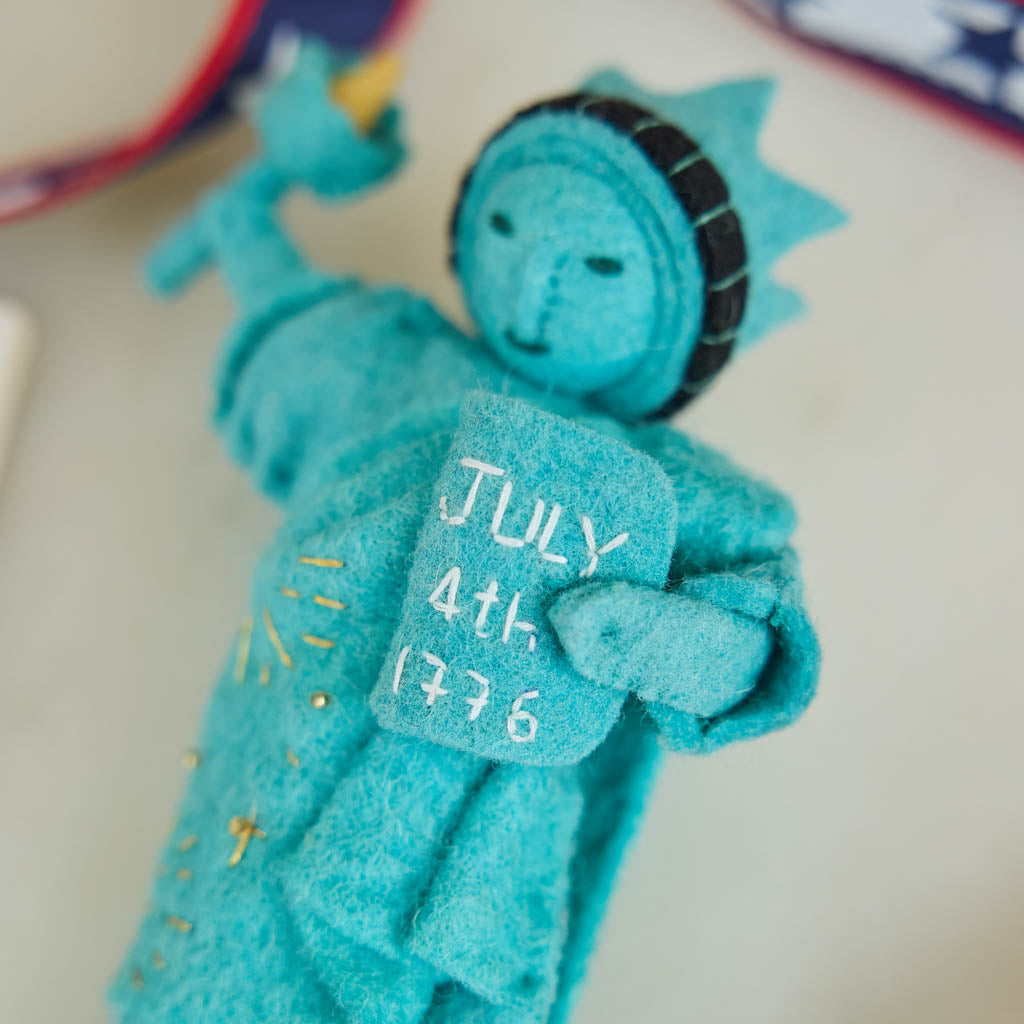 Celebrate American independence with this handcrafted July 4th Lady Liberty Ornament. Inspired by the Statue of Liberty and the founding of the United States, it's perfect for Christmas trees, Fourth of July celebrations, and Americana holiday décor.