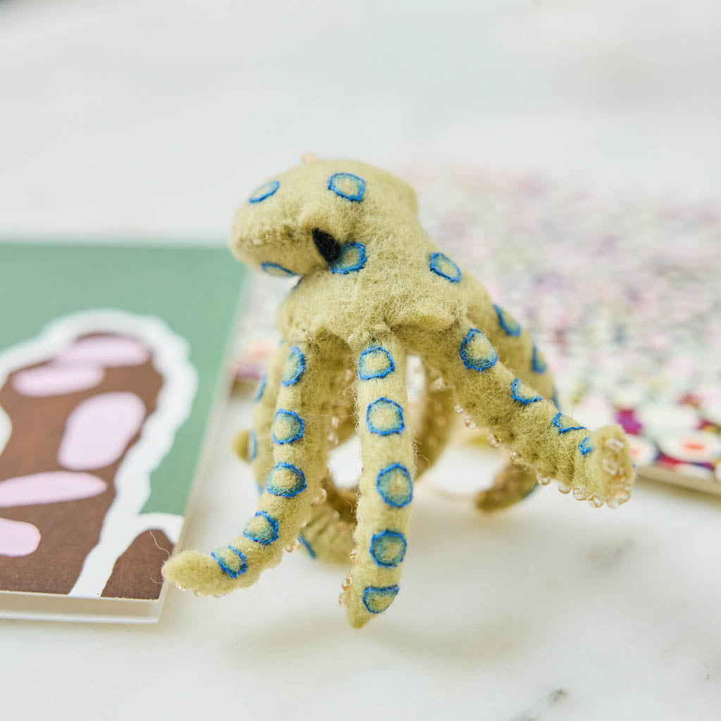 A handcrafted felt Blue-ringed Octopus Ornament inspired by one of Australia's most fascinating and recognizable marine creatures.