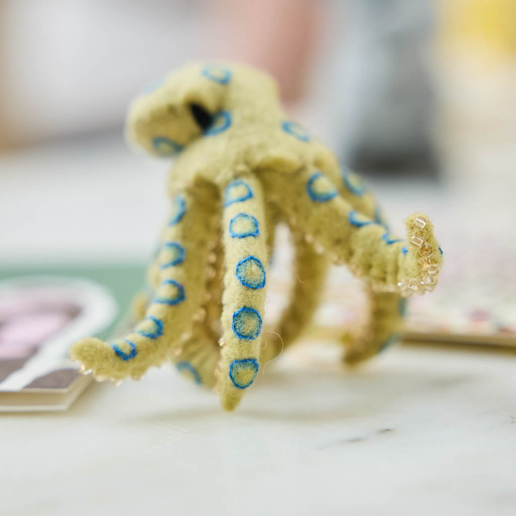 A handcrafted felt Blue-ringed Octopus Ornament inspired by one of Australia's most fascinating and recognizable marine creatures.