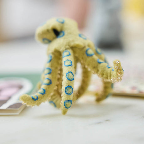 A handcrafted felt Blue-ringed Octopus Ornament inspired by one of Australia's most fascinating and recognizable marine creatures.