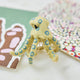 A handcrafted felt Blue-ringed Octopus Ornament inspired by one of Australia's most fascinating and recognizable marine creatures.