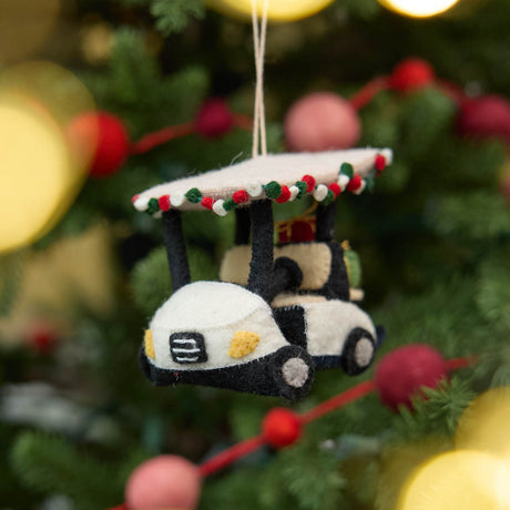 Our Holiday Golf Cart Ornament is ready to roll into the season with tropical flair! Decorated with a cheerful red, green, and white garland around the roof and carrying tiny wrapped presents in the back, this festive golf cart is the perfect ride for Christmas in paradise.