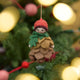 Waldorf-inspired, our Little Pinecone Kid Ornament captures the whimsical spirit of a woodland fairy tale. With its cute woolen bonnet, it's pine-green scarf and lovely layered pinecone petals and sweet as can be felted booties - this pinecone child is ready to capture woodland hearts.