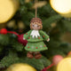 Inspired by the gentle wonder of Waldorf traditions, our Little Acorn Kid Ornament captures the whimsical spirit of a woodland fairy tale. Wearing an adorable felted acorn cap and a charming oak-leaf skirt.