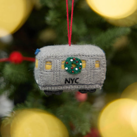 Celebrate the rhythm of New York City with our handmade NYC Subway Train Car Ornament, a charming felt keepsake inspired by the iconic subway cars that keep the city moving.