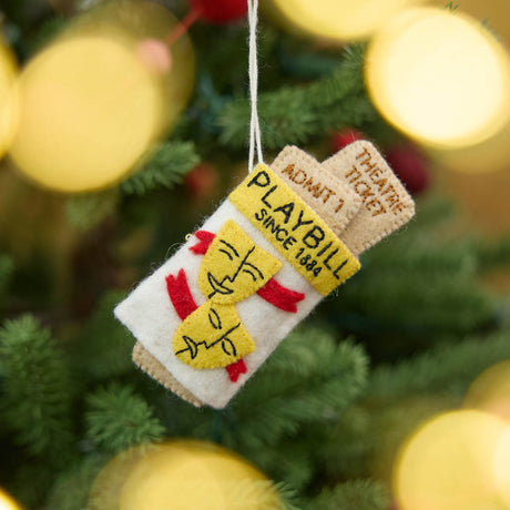 Celebrate the magic of Broadway with our handmade Playbill Ornament, inspired by the iconic theater program and finished with a hidden "Bravo!" message to honor every unforgettable performance.