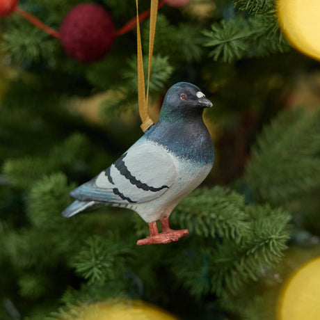 A hand-painted Rock Dove Pigeon Ornament, handmade in the Philippines with softly shaded details and a satin hanging ribbon.


A familiar city friend takes on old-world charm in our Rock Dove Pigeon Ornament. 