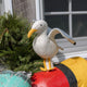 Let your holiday décor take flight with our handcrafted Seagull Tree Topper, a whimsical coastal alternative to the traditional star or angel. With wings fully outstretched, bright yellow legs, and classic black-tipped feathers, this charming seabird captures the freedom and beauty of life by the ocean.