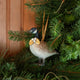 A vintage-inspired Canada Goose Resin Ornament, hand-painted in the Philippines with classic black-and-white markings, a golden metal holly necklace, and satin hanging ribbon.