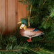 A vintage-inspired Mallard Duck Resin Ornament, hand-painted in the Philippines with a golden metal holly necklace and satin hanging ribbon.