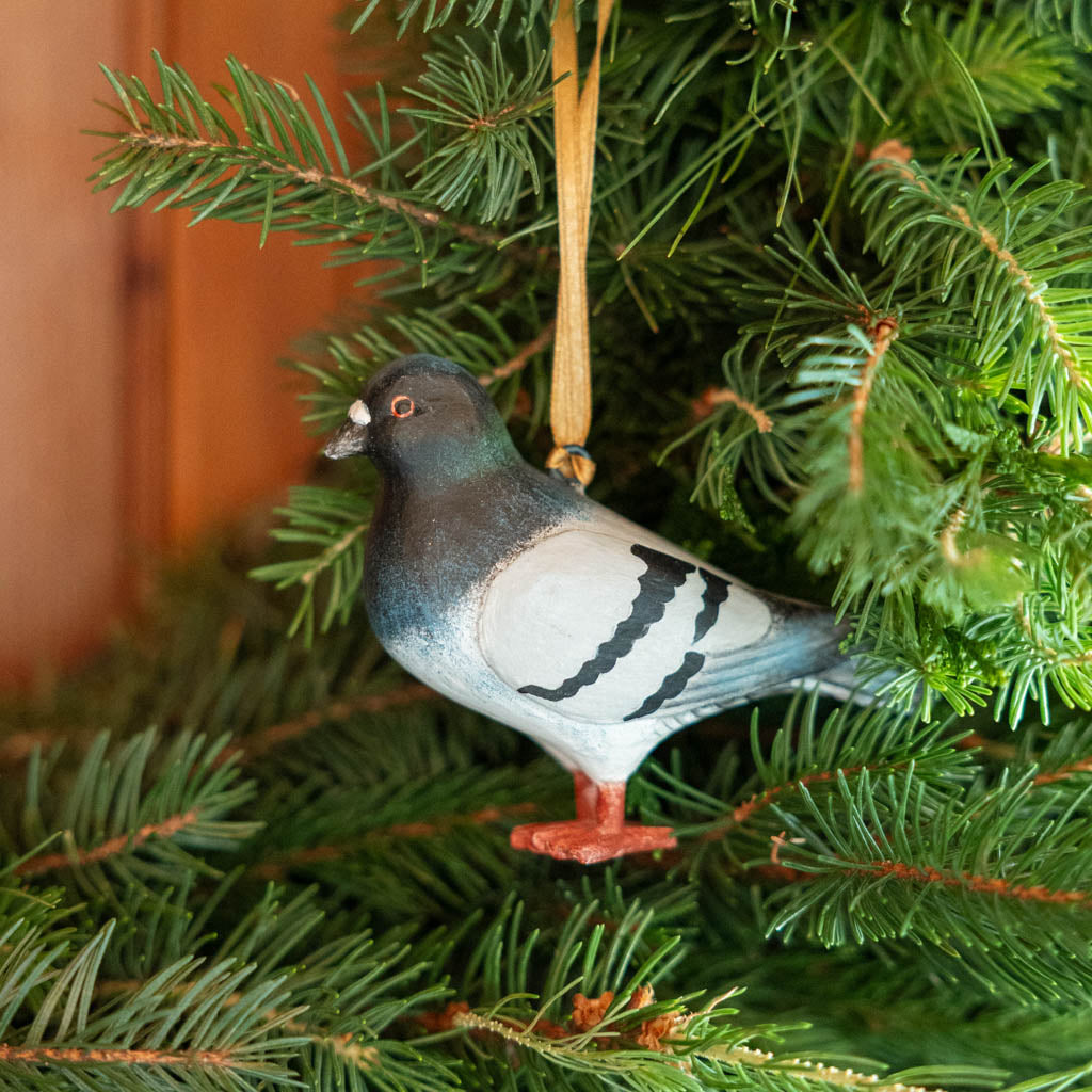 A hand-painted Rock Dove Pigeon Ornament, handmade in the Philippines with softly shaded details and a satin hanging ribbon.


A familiar city friend takes on old-world charm in our Rock Dove Pigeon Ornament. 