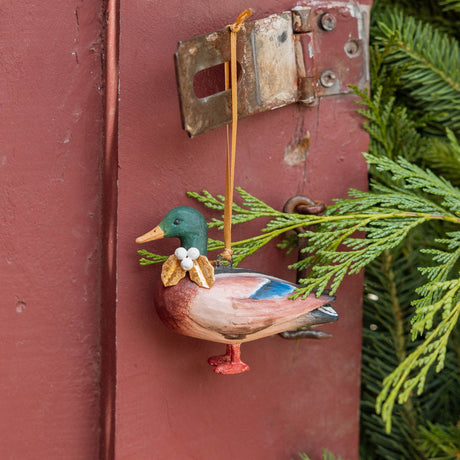 A vintage-inspired Mallard Duck Resin Ornament, hand-painted in the Philippines with a golden metal holly necklace and satin hanging ribbon.