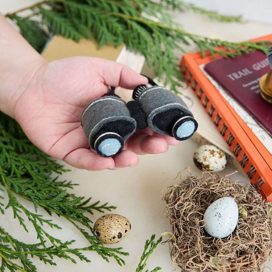 See the world through curious eyes with this hand-felted binoculars ornament, inspired by wildlife watching, outdoor exploration, and the thrill of discovering nature's hidden wonders.