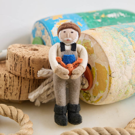 Celebrate the hardworking spirit of America’s coastal fishing communities with this handcrafted Dungeness Crab King Ornament, ethically made from sustainable wool and inspired by generations of fishermen who make their living from the sea.