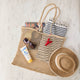 Effortlessly stylish and endlessly versatile, our Raffia Tote Bag is designed for beach days, market strolls, weekend getaways, and everyday adventures. Hand-crocheted from natural raffia fibers, this lightweight tote combines timeless coastal style with practical functionality, creating a beautiful accessory you'll reach for season after season.