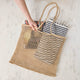 Effortlessly stylish and endlessly versatile, our Raffia Tote Bag is designed for beach days, market strolls, weekend getaways, and everyday adventures. Hand-crocheted from natural raffia fibers, this lightweight tote combines timeless coastal style with practical functionality, creating a beautiful accessory you'll reach for season after season.