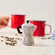 Handcrafted from natural wool felt, this charming ornament is inspired by the classic stovetop camping percolator—a beloved companion for generations of campers, hikers, RV travelers, and cabin lovers. Its timeless silhouette, soft neutral tones, and handcrafted stitching evoke memories of peaceful mornings surrounded by towering pines, fresh mountain air, and the sounds of nature waking up.