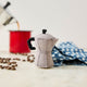 There's nothing quite like that first cup of coffee in the great outdoors. Our Camp Coffee Percolator Ornament is a nostalgic tribute to cozy campsite mornings, crackling campfires, and the comforting ritual of brewing coffee before setting off on the day's adventure.