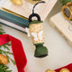 Handcrafted from natural wool felt, this charming vintage-inspired lantern ornament features soft ivory tones accented with shimmering golden beadwork that mimics the gentle glow of lantern light. Delicate felt moths flutter around the lantern, adding a whimsical touch that captures the quiet magic of nature at dusk. 