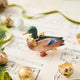 A vintage-inspired Mallard Duck Resin Ornament, hand-painted in the Philippines with a golden metal holly necklace and satin hanging ribbon.