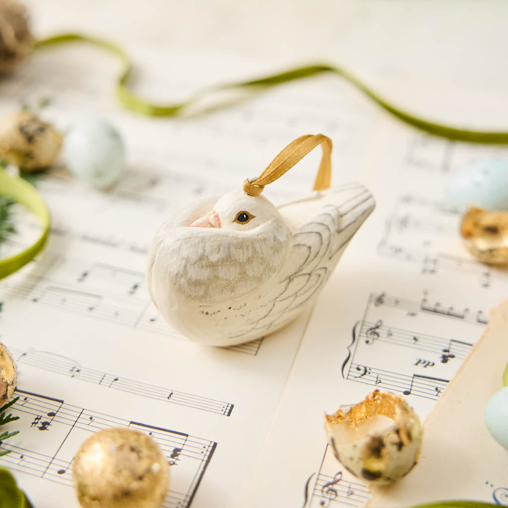 A handmade Holle Cropper Pigeon Ornament featuring a hand-painted resin bird with a distinctive puffed chest, creamy white plumage, and satin hanging ribbon.