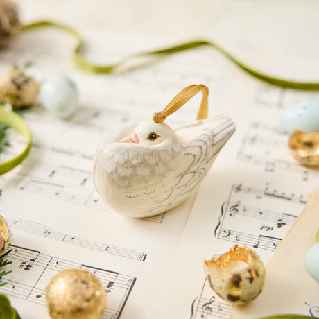 A handmade Holle Cropper Pigeon Ornament featuring a hand-painted resin bird with a distinctive puffed chest, creamy white plumage, and satin hanging ribbon.