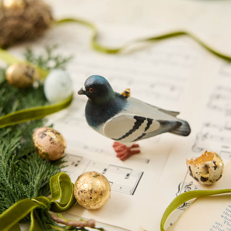 A hand-painted Rock Dove Pigeon Ornament, handmade in the Philippines with softly shaded details and a satin hanging ribbon.


A familiar city friend takes on old-world charm in our Rock Dove Pigeon Ornament. 