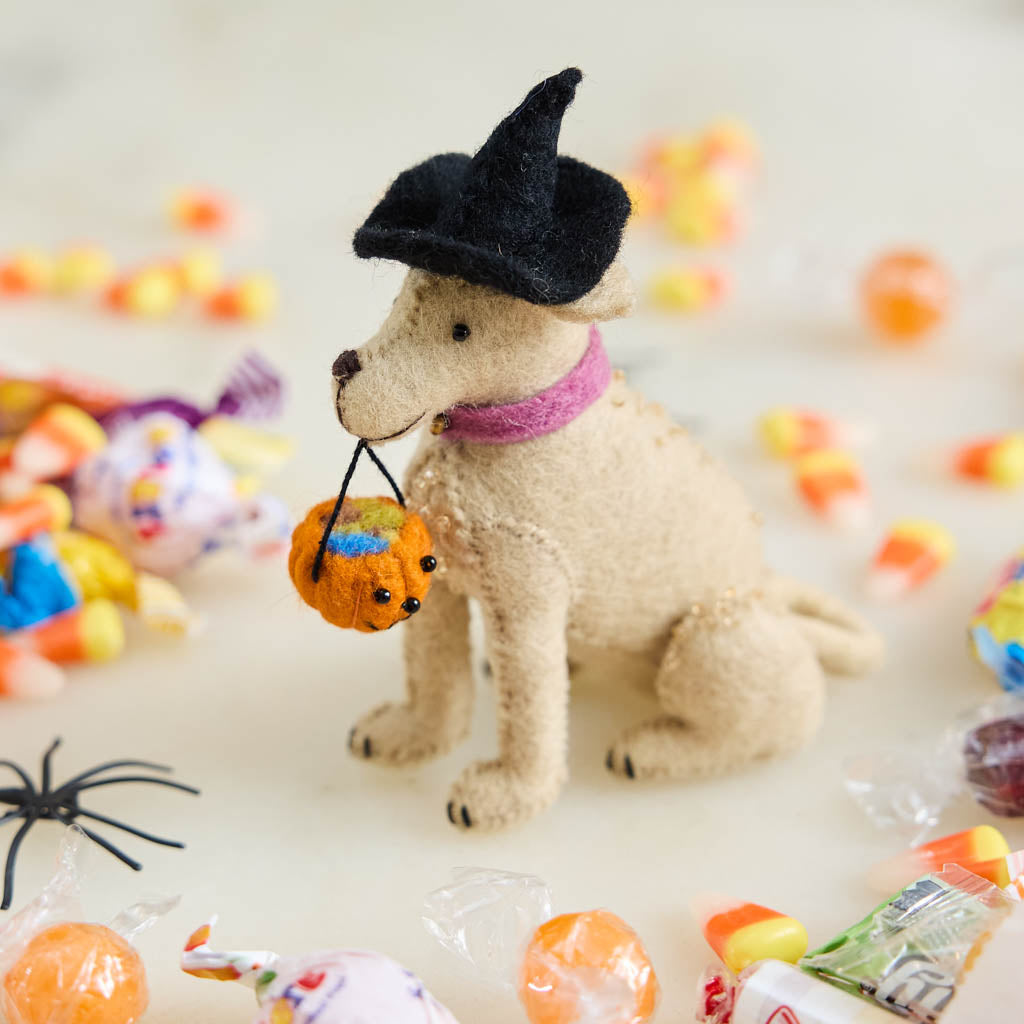 A handmade felt Halloween Lab Ornament featuring a Labrador retriever dressed in a witch hat and carrying a tiny jack-o’-lantern trick-or-treat bucket.