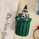 Every city has its unofficial mascot, and New York's just might be the mischievous raccoon. Meet our Trash Raccoon Ornament, peeking curiously from inside a classic green city trash can with the sweetest little face you've ever seen. Don't worry—this tiny trash panda is all charm and absolutely no trouble.