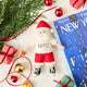 Celebrate Christmas in the Big Apple with our handmade NYC Santa Ornament, featuring Santa dressed like a true New Yorker with an NYC tee and a classic slice of New York pizza.

Who says Santa only runs on milk and cookies? After a busy night delivering gifts across the five boroughs, he's treating himself to a well-earned slice of New York pizza.