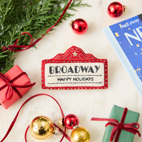 Capture the magic of Broadway with our handmade Broadway Marquee Ornament, a festive felt tribute to New York City's legendary Theater District and the unforgettable joy of live performance.